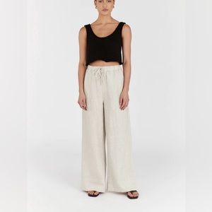 DISSH Black Top and Cream Wide-Leg Pants